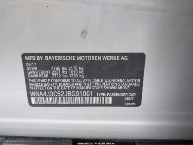 WBA4J3C52JBG91061 9